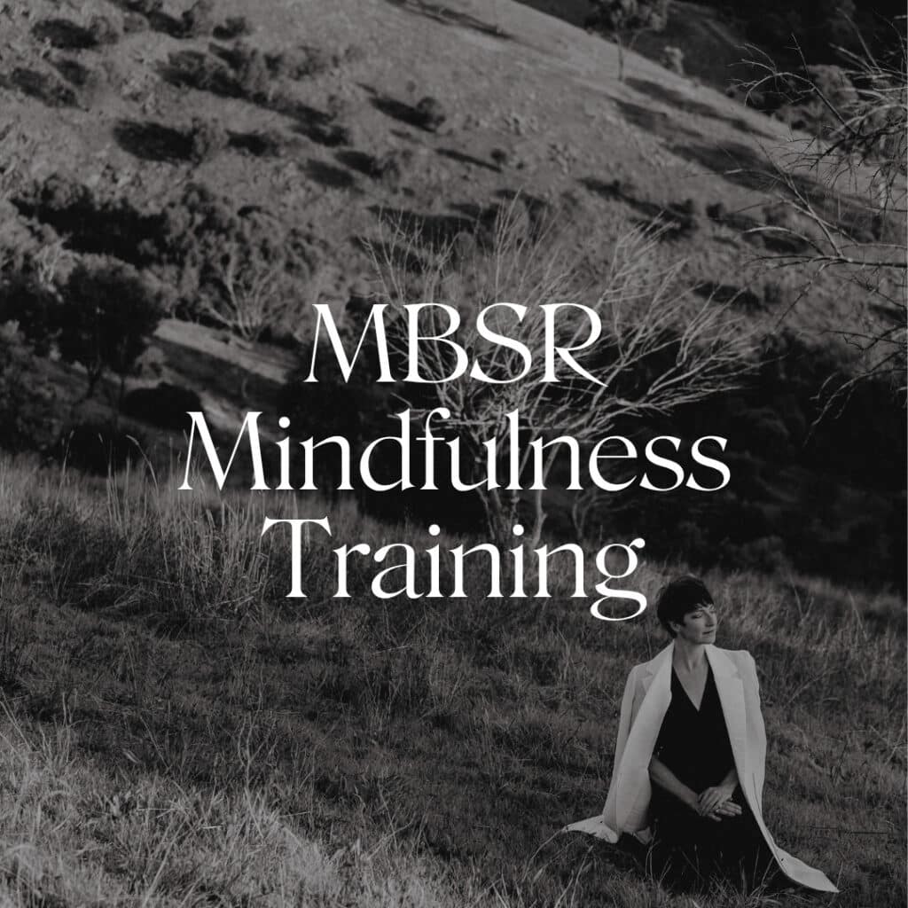 a woman sits in a field with the words 'mbsr mindfulness training' overtop